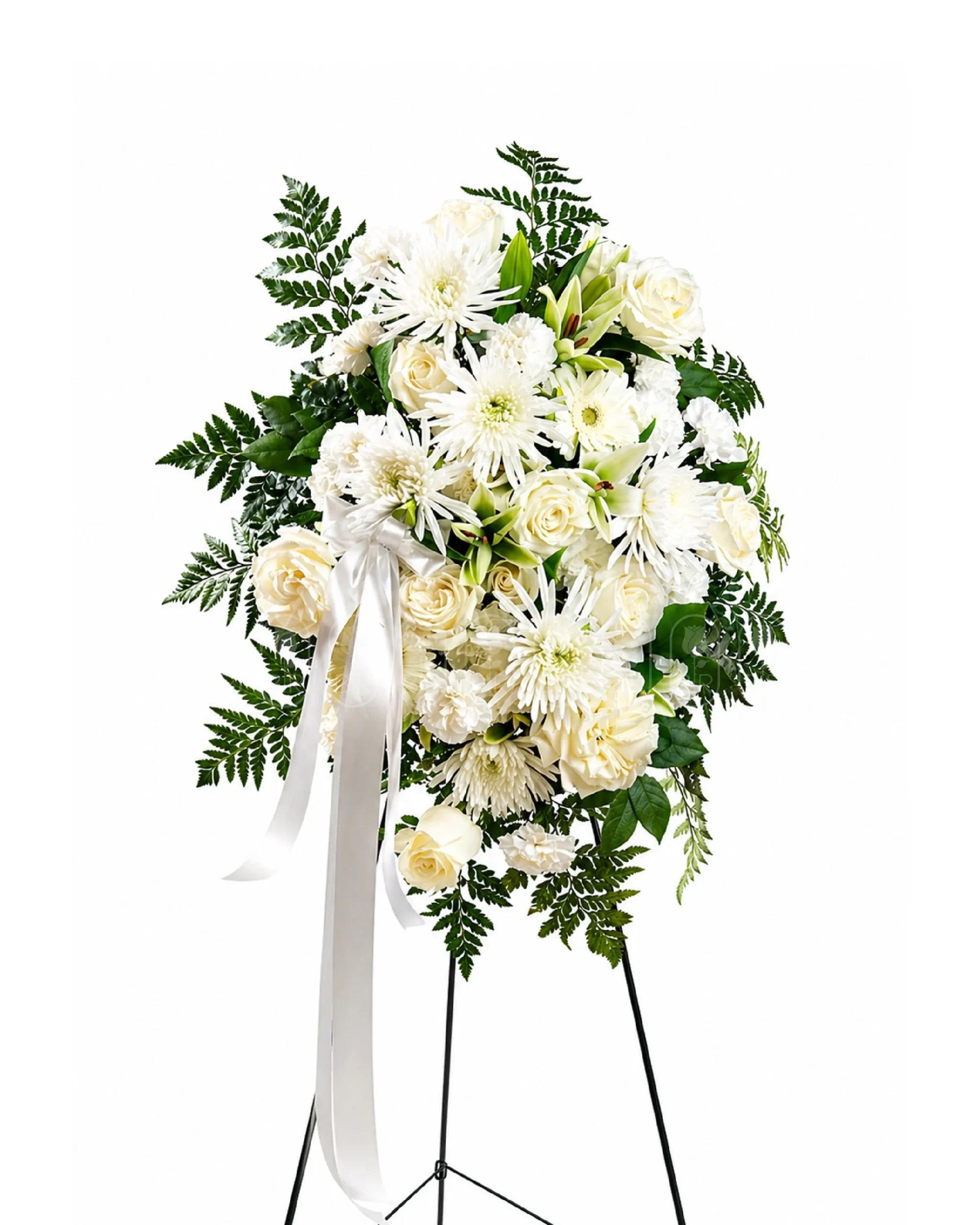 Elegant white funeral flower arrangement with roses, lilies, and chrysanthemums on a standing floral easel