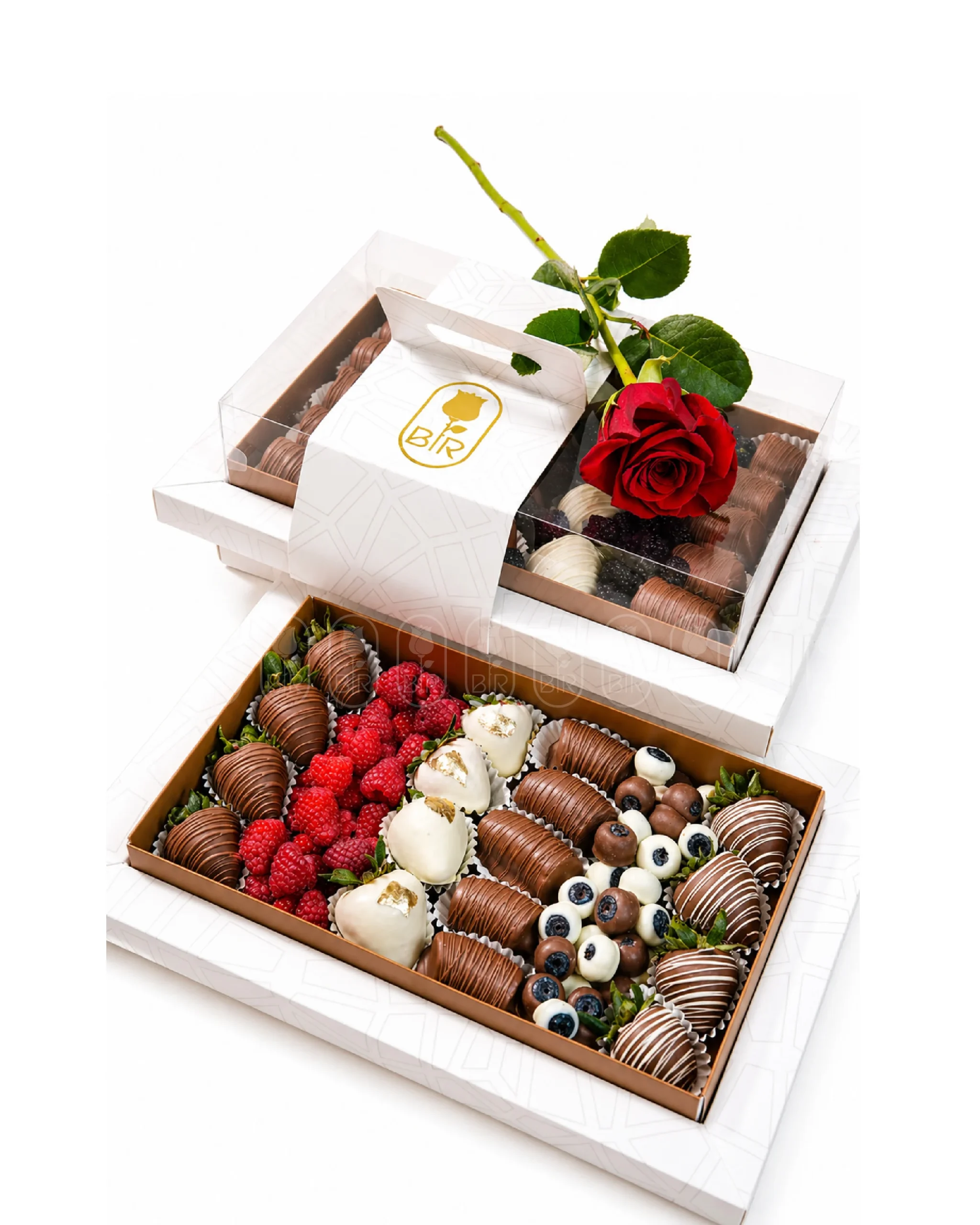 Luxury chocolate-dipped strawberry gift boxes with fresh red rose, raspberries, and premium mixed chocolate strawberries