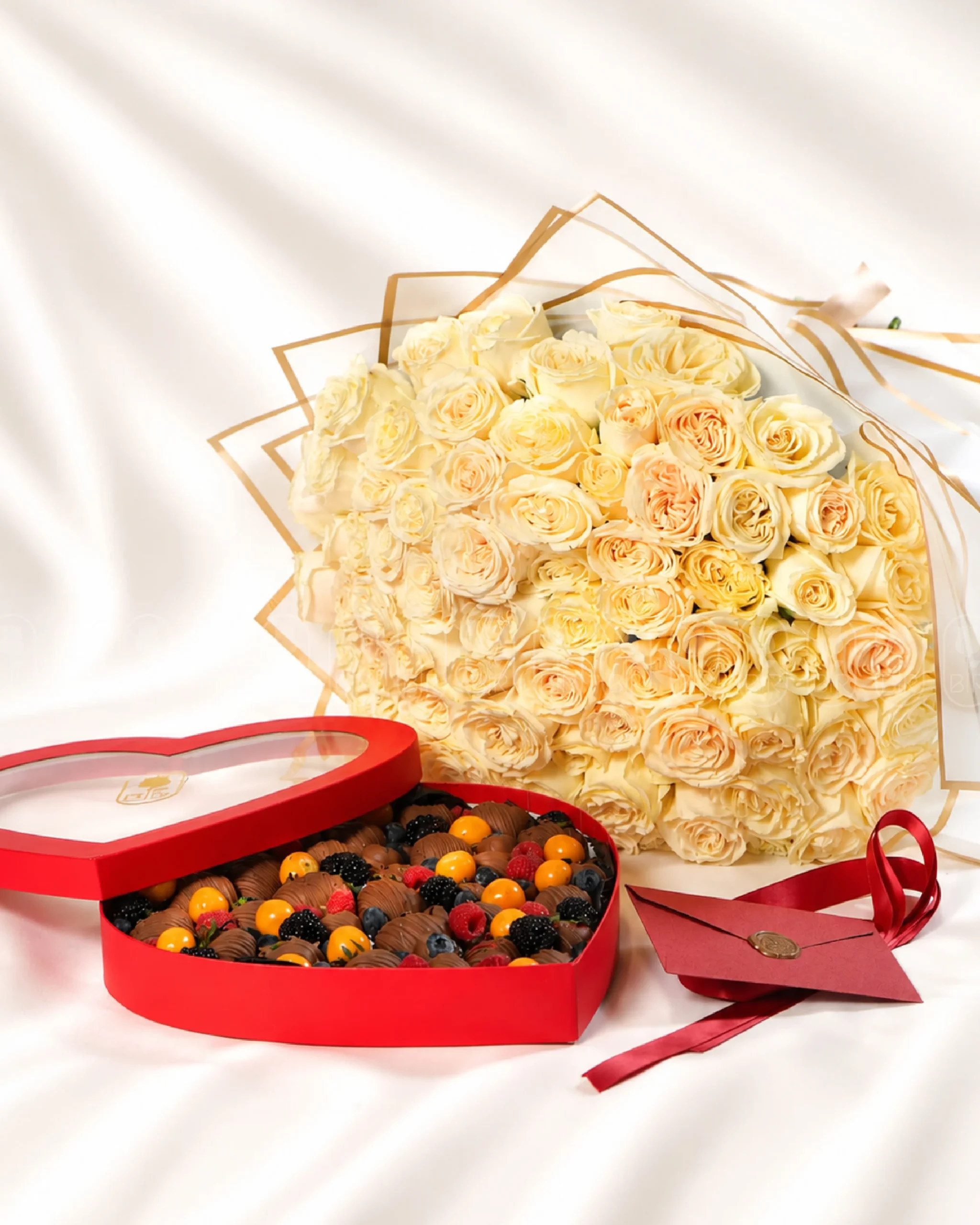 Luxury ivory rose bouquet with heart-shaped Belgian chocolate strawberry box and berries