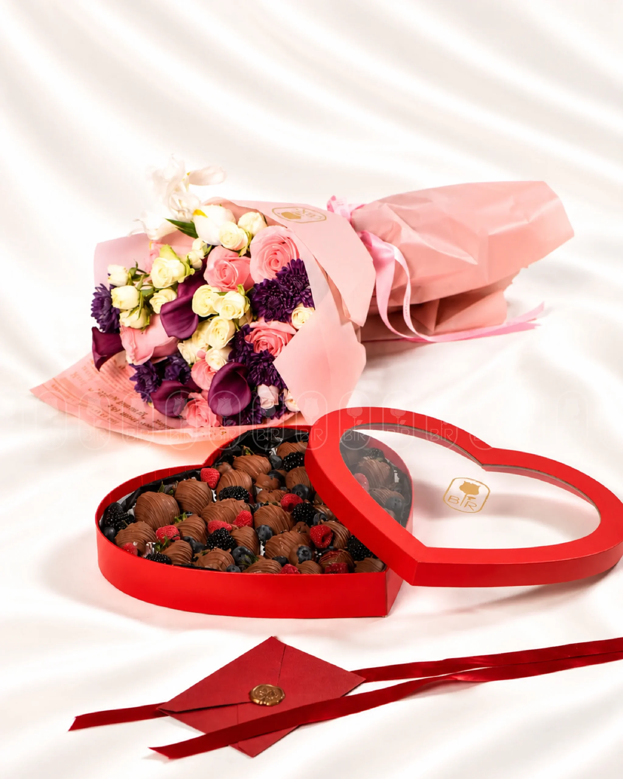 Designer flower bouquet with heart-shaped box of Belgian chocolate-covered strawberries