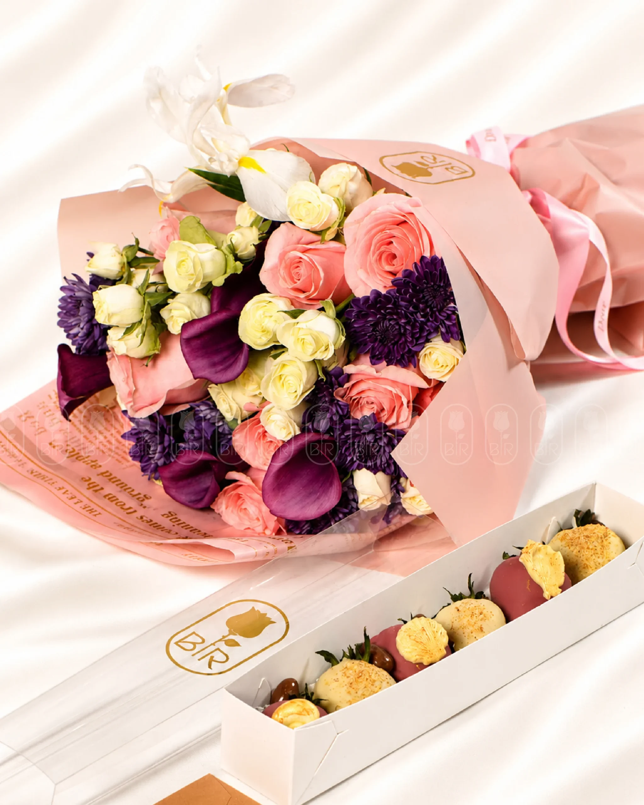 Mixed designer bouquet with pink roses, purple flowers, and Belgian chocolate strawberries