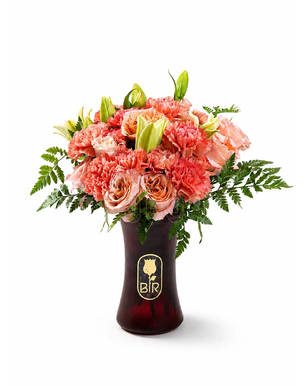Elegant peach and coral flower arrangement in a dark vase