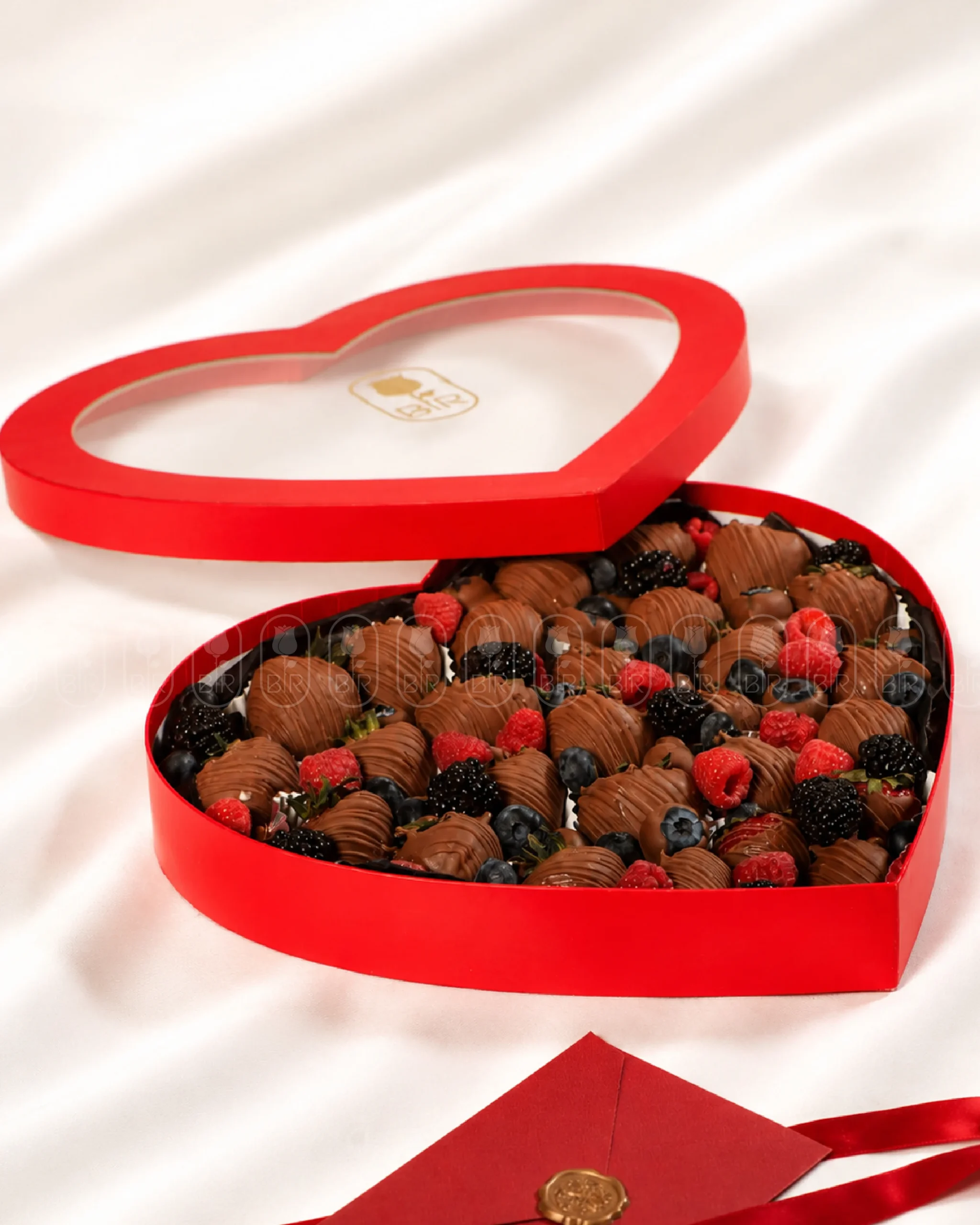 Heart-shaped box filled with Belgian chocolate-covered strawberries, raspberries, blackberries, and blueberries