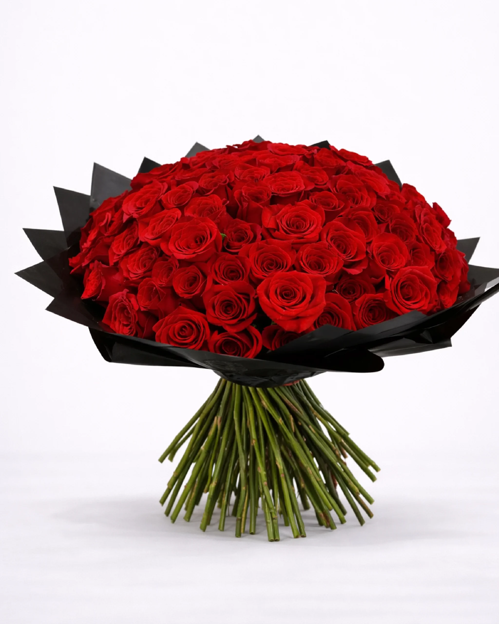 100 long-stem red roses bouquet with visible stems and black wrap