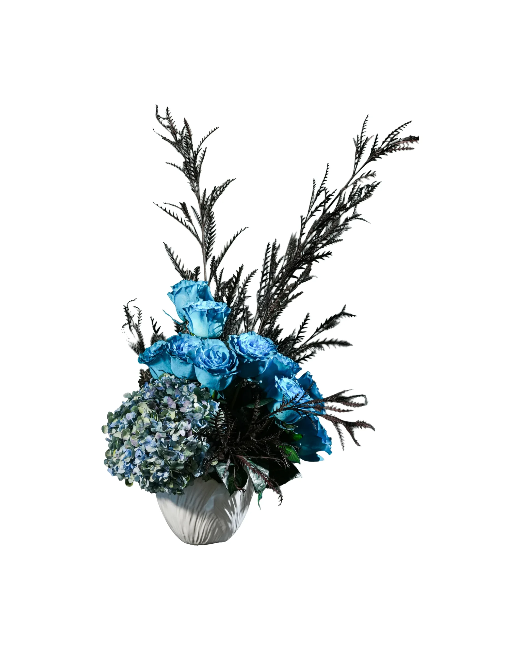 Turquoise blue roses with hydrangea and dark foliage in vase